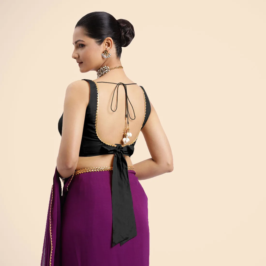 Raisa x Tyohaar | Charcoal Black Sleeveless FlexiFit™ Saree Blouse with V Neckline with Golden Gota Lace Embellishment and Back Cut-out with Tie-Up