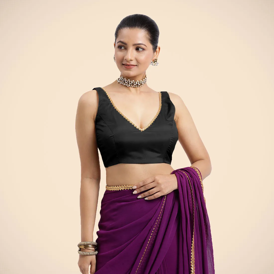 Raisa x Tyohaar | Charcoal Black Sleeveless FlexiFit™ Saree Blouse with V Neckline with Golden Gota Lace Embellishment and Back Cut-out with Tie-Up